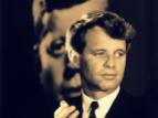 At a campaign dinner in Ohio, Senator Robert F. Kennedy stands before a photograph of his late brother, President John F. Kennedy, 1966. Photograph ©Bill Eppridge. All Right Reserved.